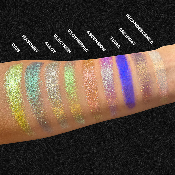Arm swatches of Exothermic and the rest of the Stained Glass Expansion Bundle on medium skin tone, on a black background.