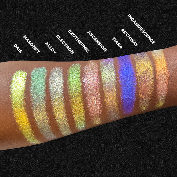 Arm swatches of Exothermic and the rest of the Stained Glass Expansion Bundle on deep skin tone, on a black background.