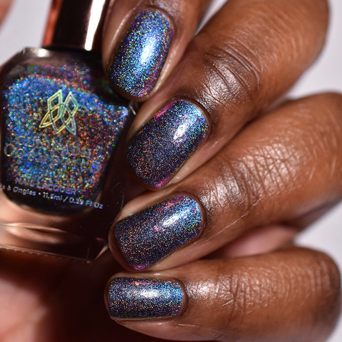 Close up shot of nails done with Flying Buttress Nail Lacquer on deep skin tone.