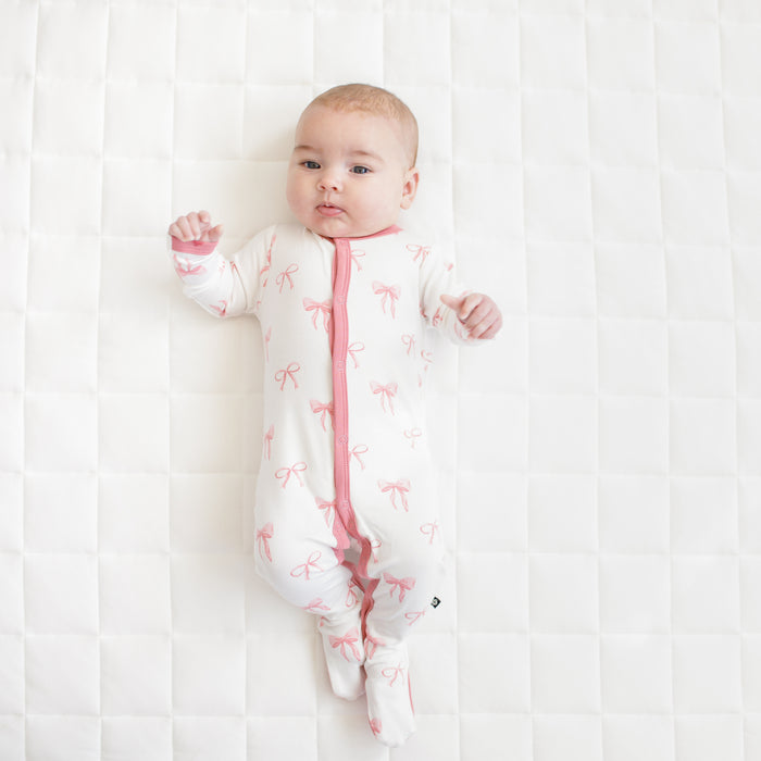 Baby modeling Footie in Bow