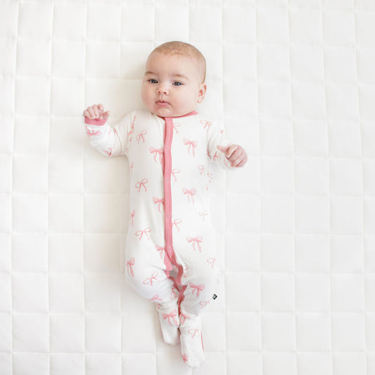 Baby modeling Footie in Bow