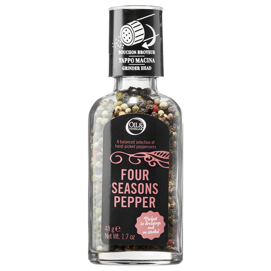 A clear glass bottle with a grinder cap containing a blend of black, white, green, and pink peppercorns, labeled 'Four Seasons Pepper'.
