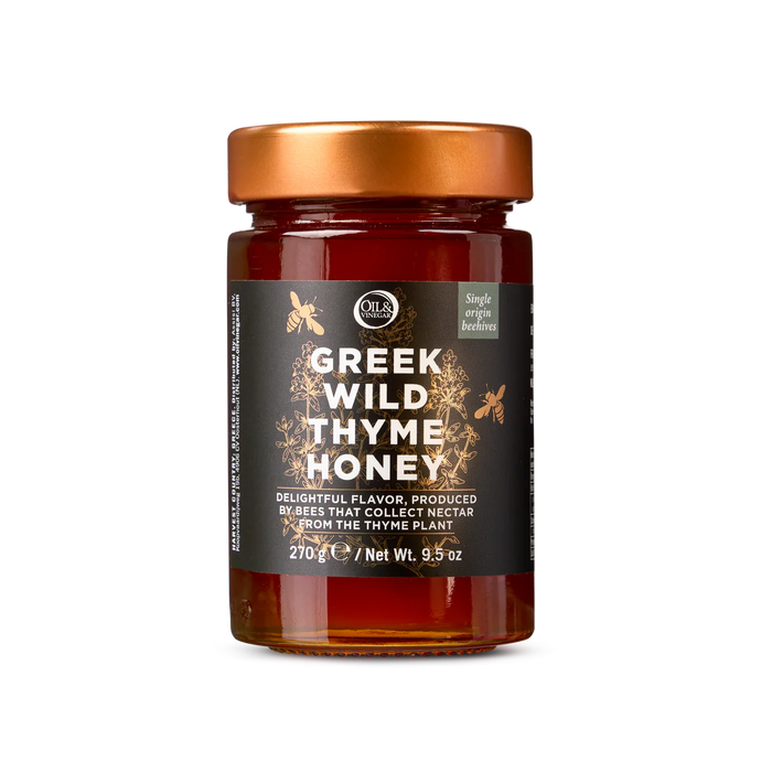 A jar of Greek wild thyme honey with a label indicating its origin and weight.