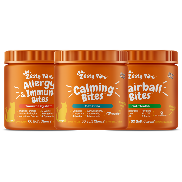 Three orange Zesty Paw supplement bottles for cats: Allergy & Immune Bites, Calming Bites, and Hairball Bites, each containin