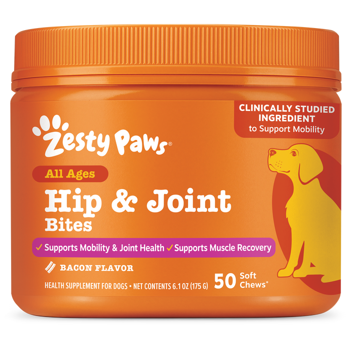 Orange plastic container of Zesty Paws Hip & Joint Bites for dogs with yellow dog illustration and bacon flavor label.