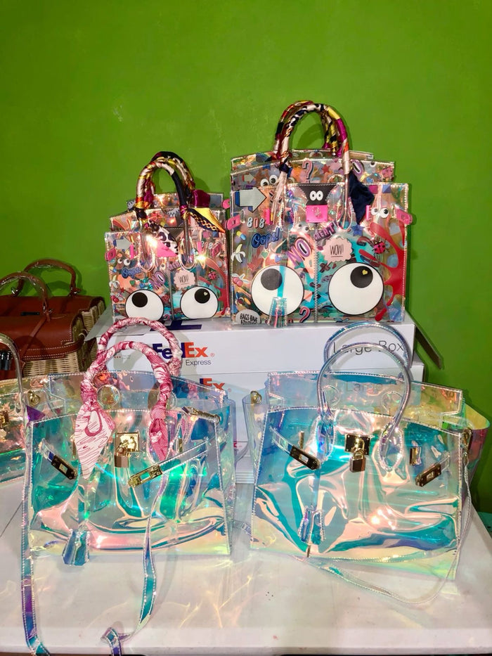 Travellers Hat Boutique holographic clear tote bag collection with colorful and clear designs