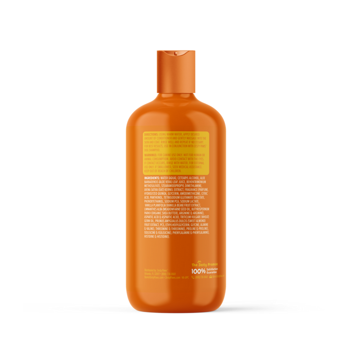 Orange plastic bottle of dog conditioner with yellow and white label text on front and back.