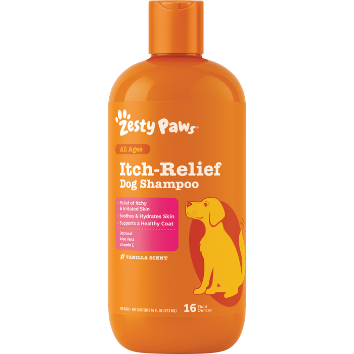 Orange plastic bottle of Zesty Paws Itch-Relief Dog Shampoo with white text, pink panel, and yellow dog illustration, 16 fl o