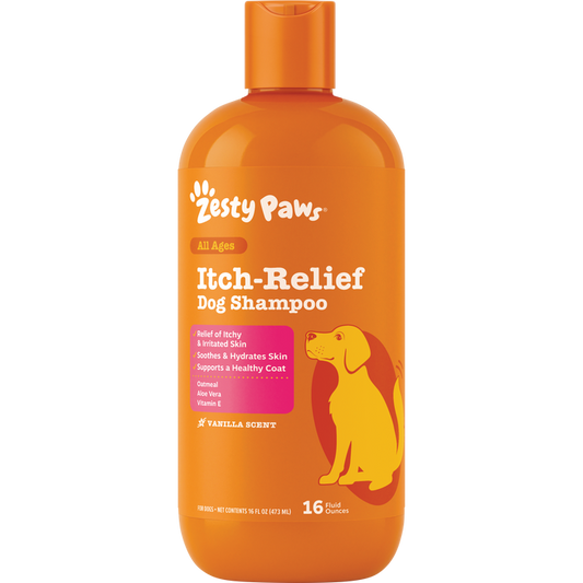 Orange plastic bottle of Zesty Paws Itch-Relief Dog Shampoo with white text, pink panel, and yellow dog illustration, 16 fl o