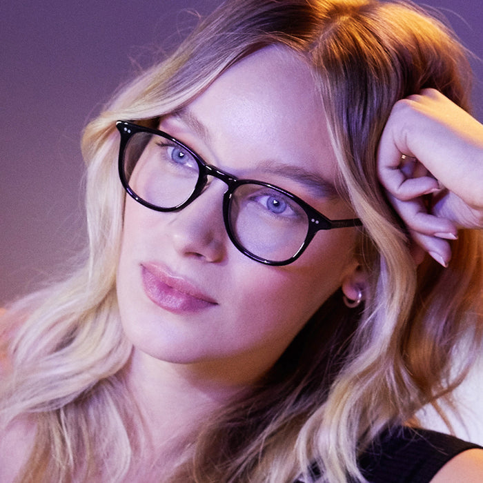 blonde female wearing jaxson black clear glasses