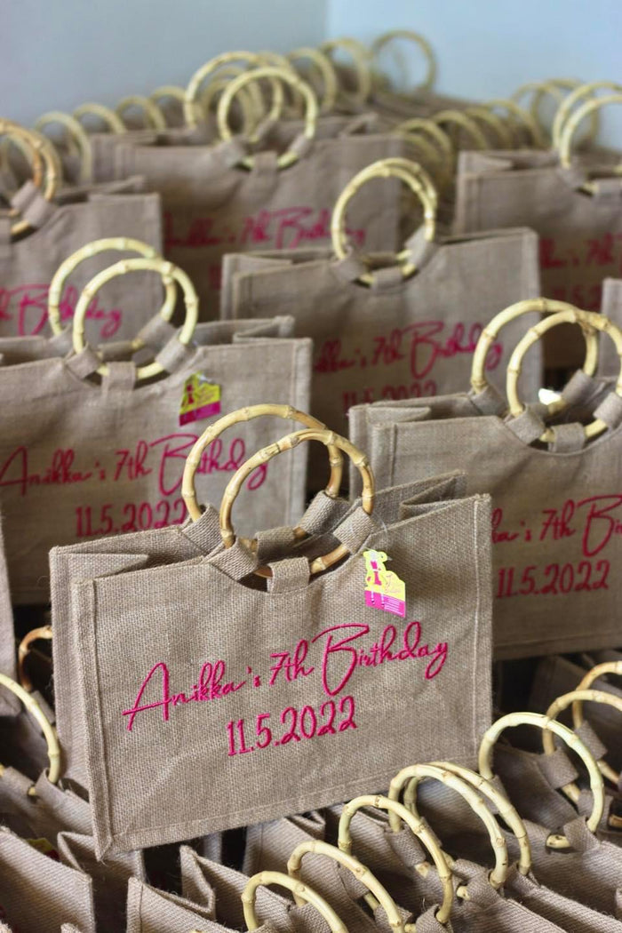 Personalized brown tote bags with bamboo handles celebrating Anikka's 7th birthday dated 11.5.2022