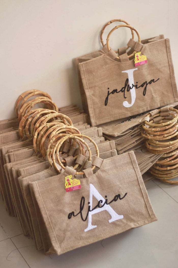 Travellers Hat Boutique personalized jute totes with bamboo handles featuring names Jadwiga and Alicia