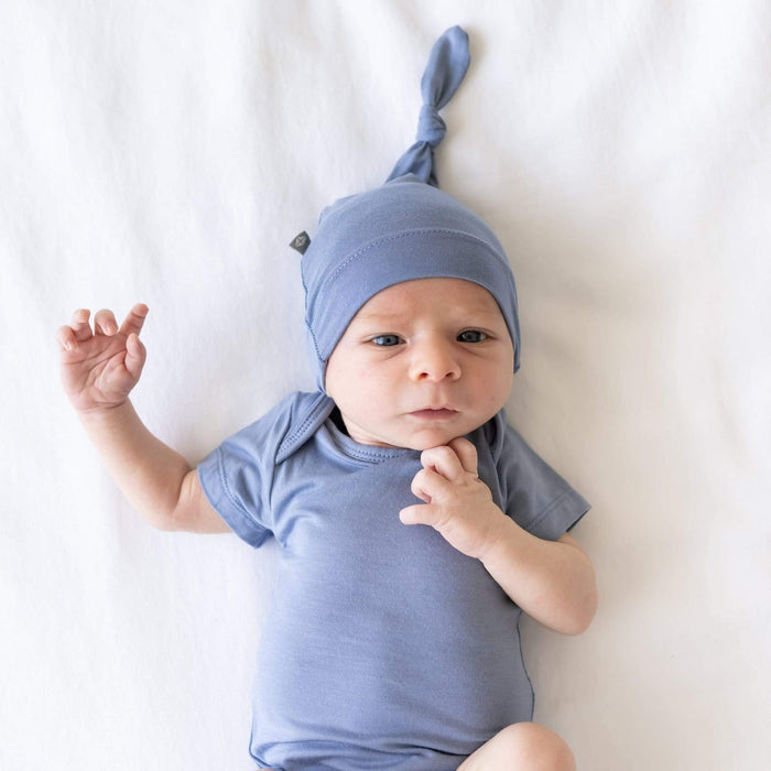Newborn wearing  Knotted Cap in Slate with a matching short sleeve bodysuit