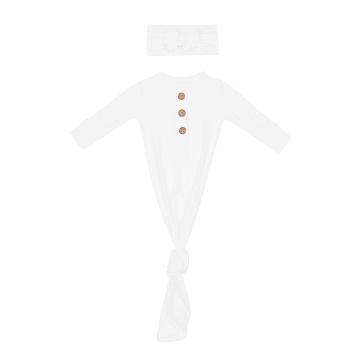 White newborn hospital outfit with knotted gown and bow headband