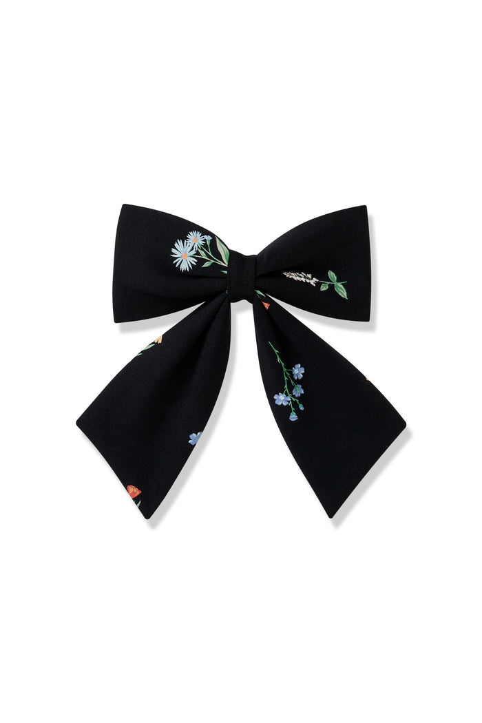 Black Large Alligator Clip Bow in Wildflower print on a white background