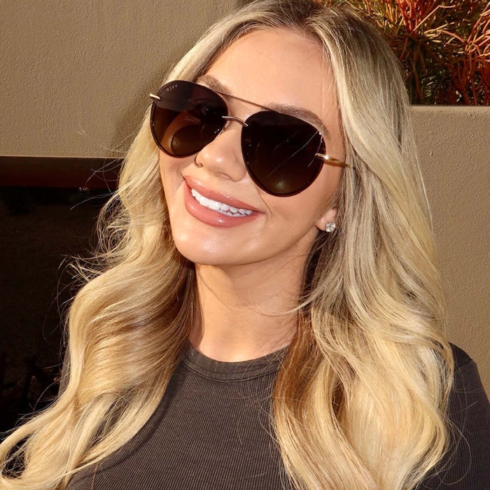 UGC - on model - Chelsea Freeman, female wearing lenox gold and black and grey gradient polarized front