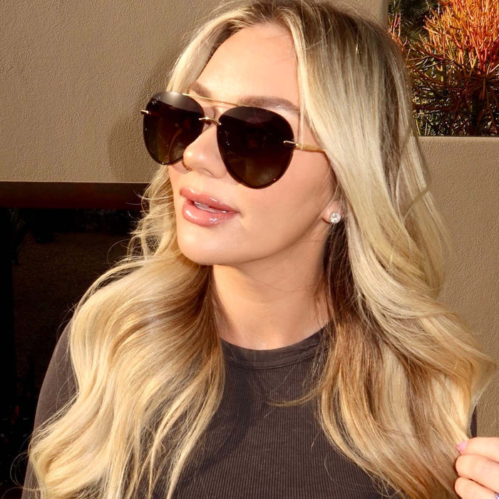 UGC - on model - Chelsea Freeman, female wearing lenox gold and black and grey gradient polarized angled