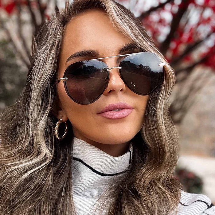 UGC - lifestyle - blonde female wearing diff eyewear lenox aviator sunglasses with a gold metal frame and g15 polarized lenses