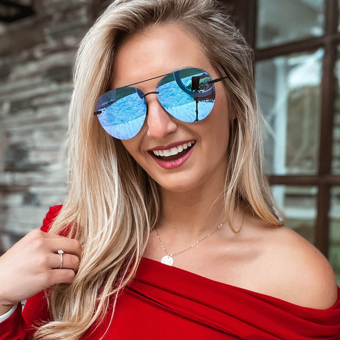 UGC - lifestyle - ambermiller9 wearing Lenox sunglasses with matte black frames and purple mirror lens front view