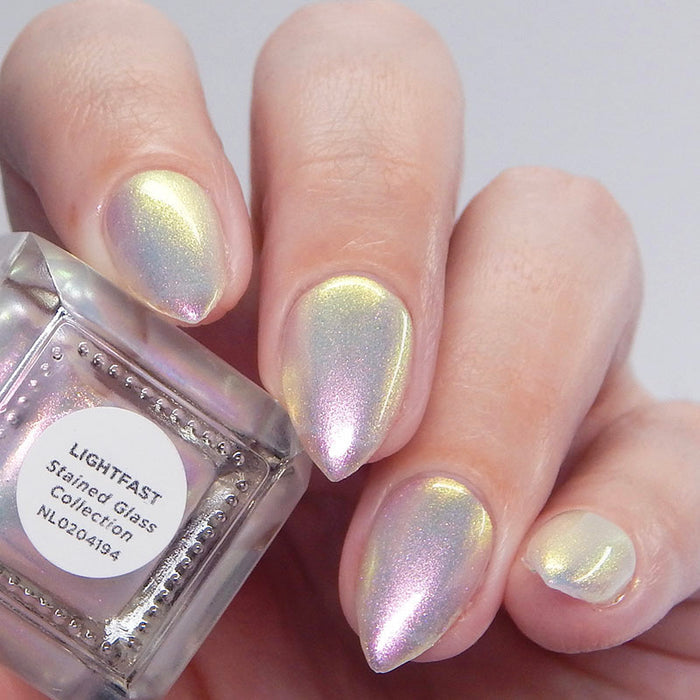 Close up shot of nails done with Lightfast Nail Lacquer on fair skin tone.