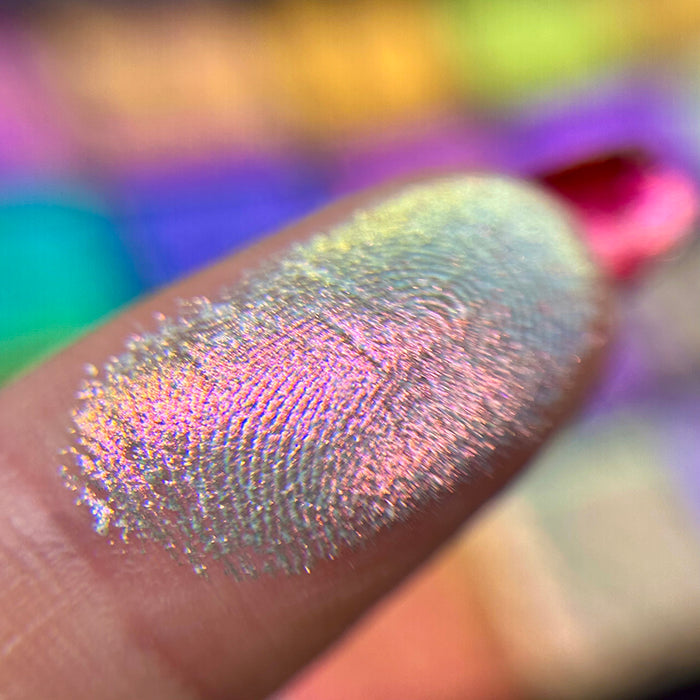 Macro finger swatch of Lightfast Iridescent Multichrome Eyeshadow.