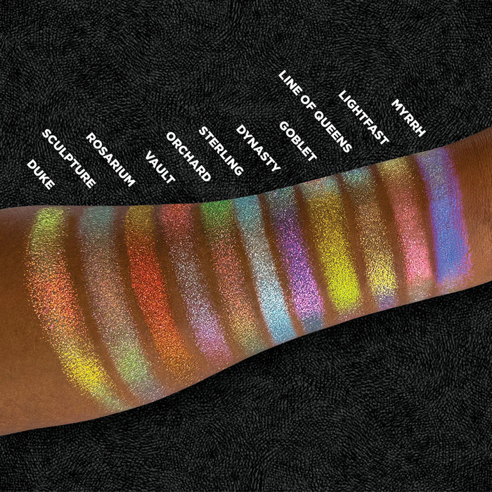 Top angled shot of swatches of Lightfast and the rest of the Holiday Expansion Bundle on deep skin tone.