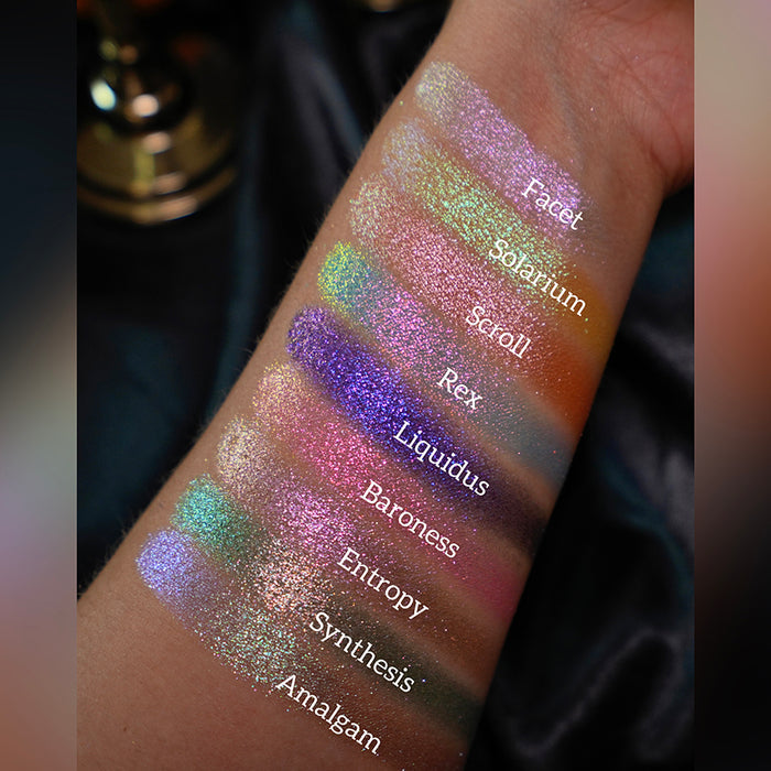 Arm swatches of the Halloween Stained Glass Expansion Bundle shadows on medium skin tone.
