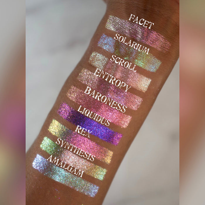 Arm swatches of the Halloween Stained Glass Expansion Bundle shadows on medium skin tone.