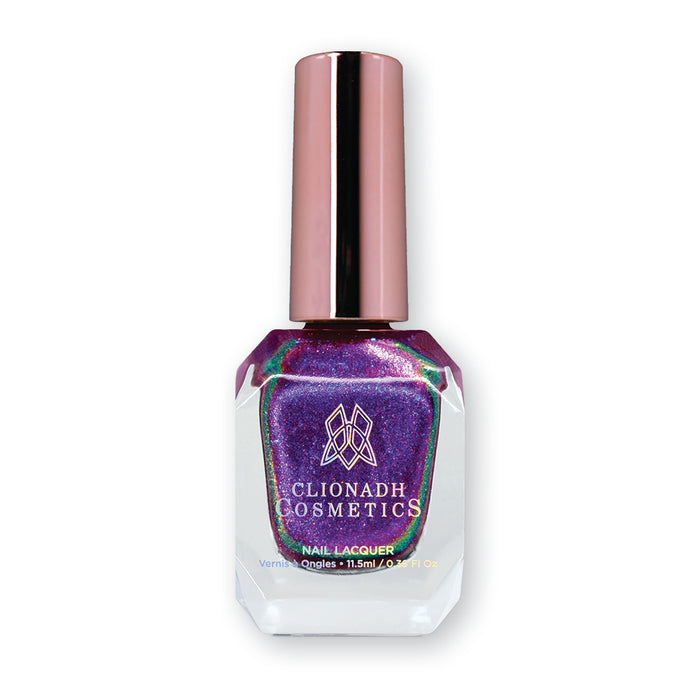 Bottle of nail polish containing Liquidus Nail Lacquer on white background.