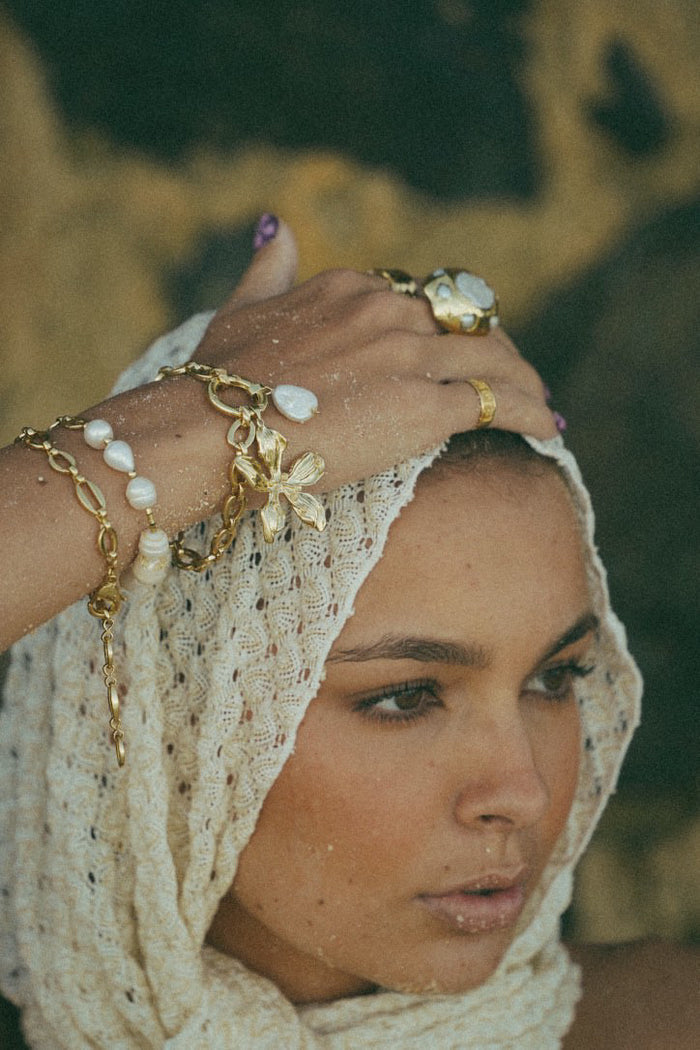 Freshwater pearl gold Lolo bracelet styled for beachy outfit
