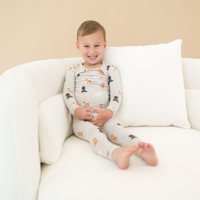 Child modeling Long Sleeve Pajamas in Fluffy Dog sitting on chair