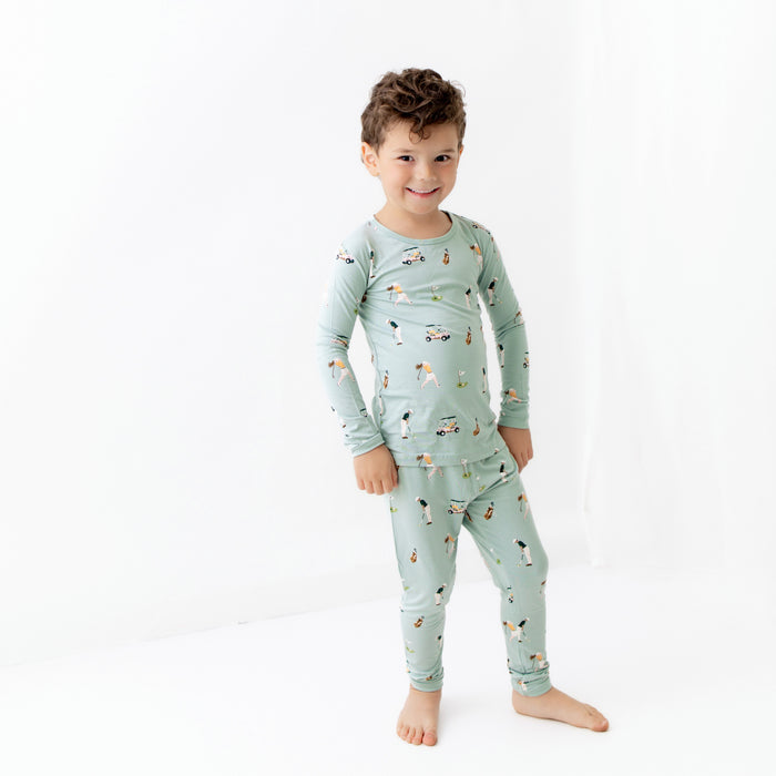 Toddler modeling bamboo Long Sleeve Pajamas in Golf