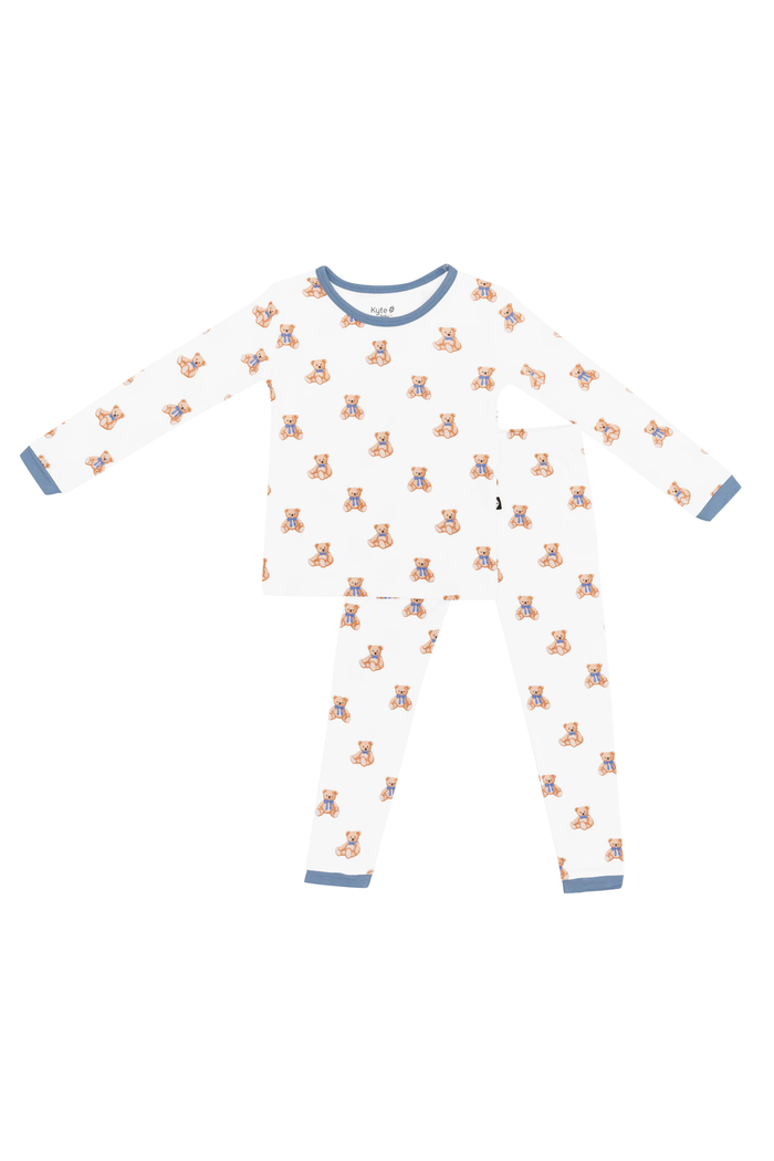 Toddler pajama set with teddy bear print and blue trim