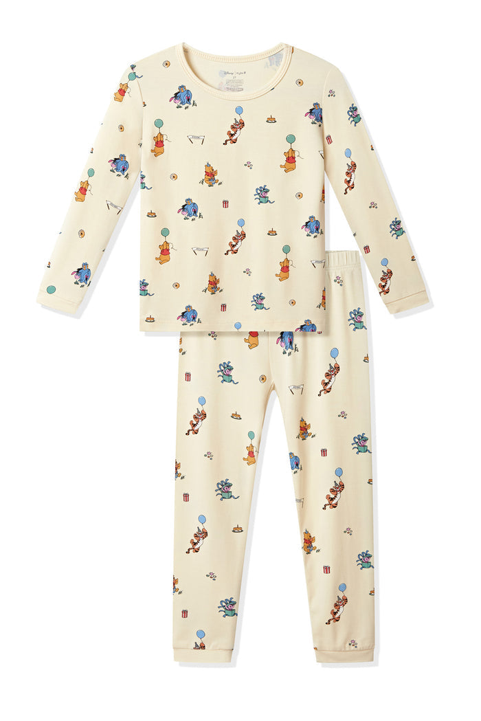 Long Sleeve Pajamas in Winnie the Pooh Celebration print on a white background
