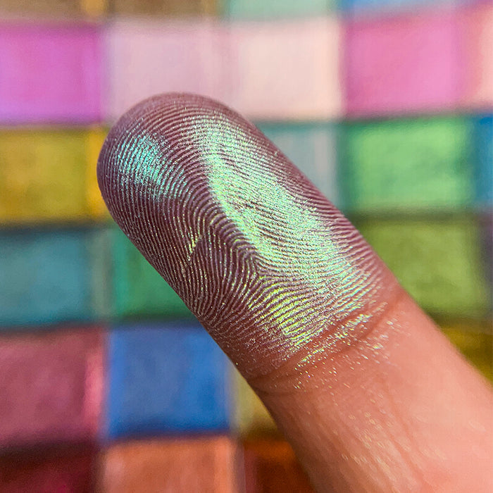Close up finger swatch of Lucidum Series 2 Iridescent Multichrome Eyeshadow