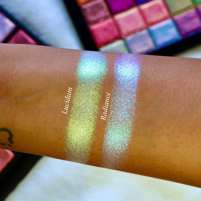 Straight angled arm swatches on medium skin tone of Lucidum Series 2 Iridescent Multichrome eyeshadow shifts compared to Radiance