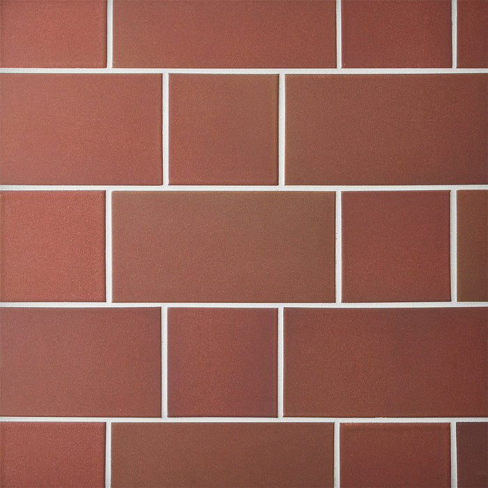 Caption: Classic Field 4x4, 4x8 in M17.2 Redwood. Prism Light Smoke grout by Custom Building Products.