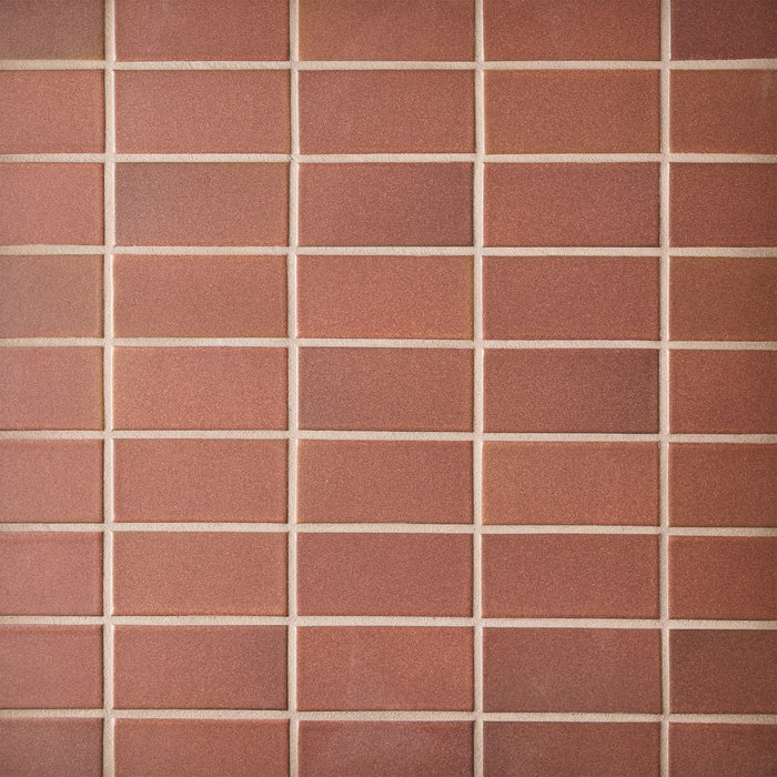 Caption: Classic Field 2x4 in M17.2 Redwood. Prism Tobacco Brown grout by Custom Building Products.