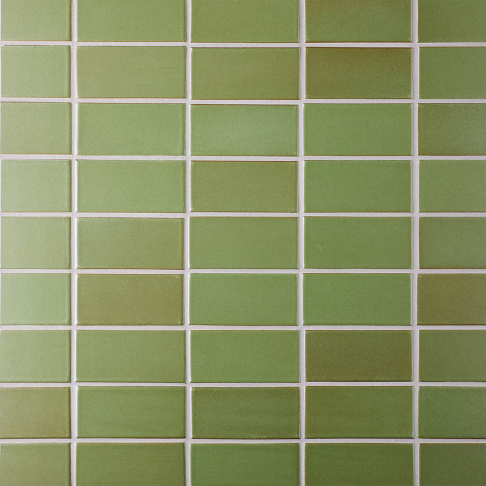 Caption: Classic Field 2x4 in M27 Olive #3. Prism Natural Grey grout by Custom Building Products.