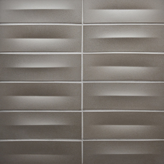 Caption: Dimensional Crease In & Crease Out in M73 Basalt. Prism Truffle grout by Custom Building Products.