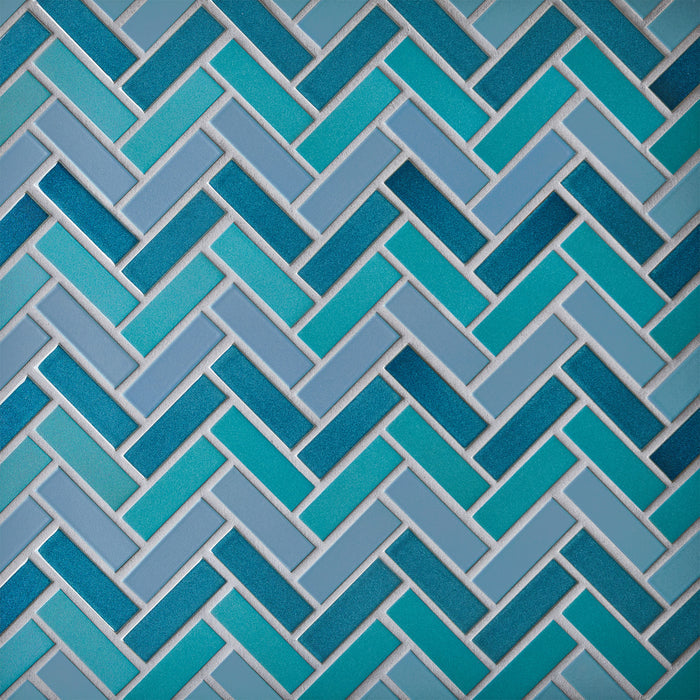 Caption: Classic Field 1x3 in M76 Tahoe Blue, M40 Turquoise, G21 Opal Pacific. Prism Dove Grey grout by Custom Building Products.