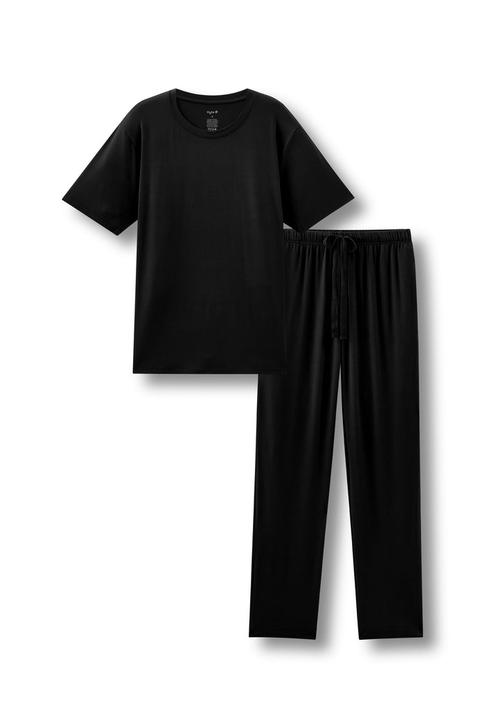 Men's pajama set featuring a black crew neck tee and black pajama lounge pants against a white background