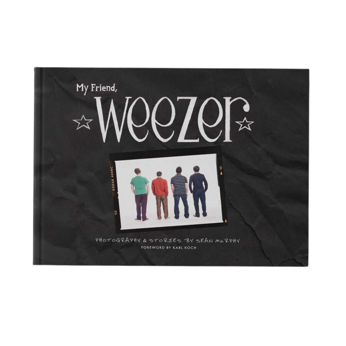 Black hardcover book my friend weezer with white stylized text and photo of rock bands in music photography from weezer official store