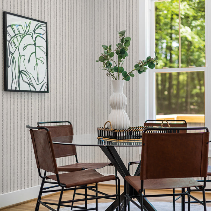 Nautical Stripe Removable Wallpaper - Four brown chairs and a table in a room featuring Tempaper's Nautical Stripe Peel And Stick Wallpaper | Tempaper
#color_charcoal-and-cotton
