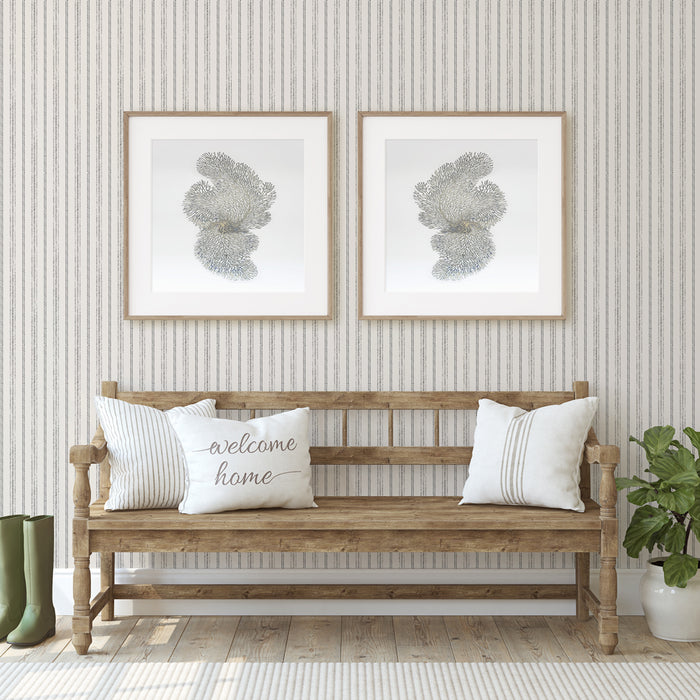 Nautical Stripe Removable Wallpaper - A wood bench and two pictures on a wall featuring Tempaper's Nautical Stripe Peel And Stick Wallpaper | Tempaper
#color_charcoal-and-cotton