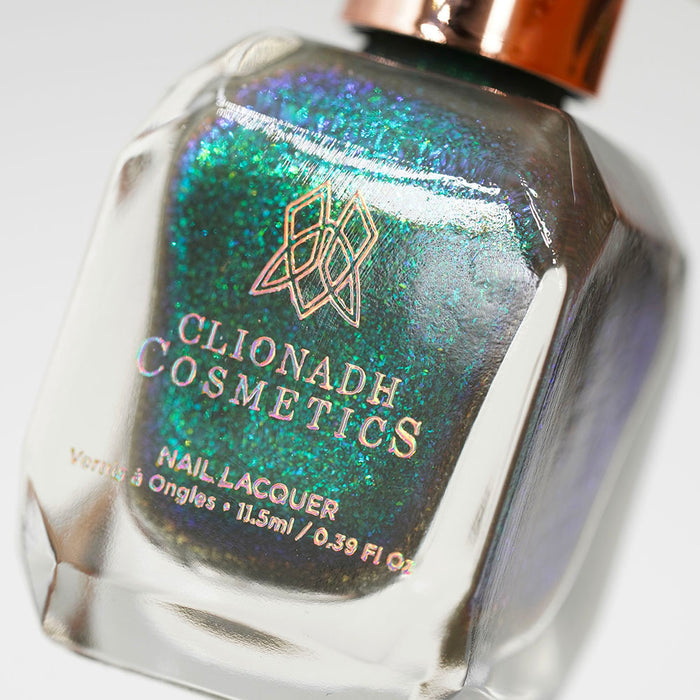 Angled, close-up of Nucleus Accumbens Nail Lacquer bottle, on a white background.