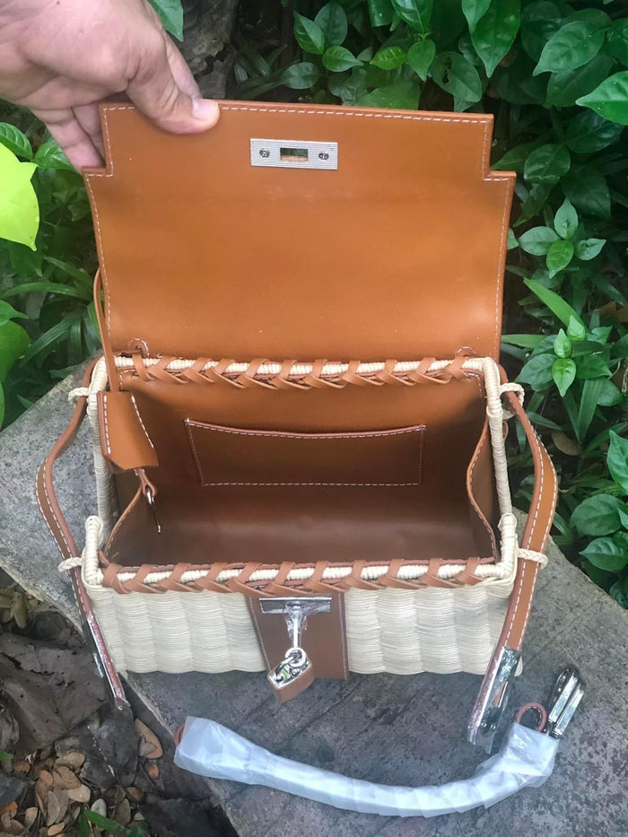 Handmade wicker purse for women with tan leather flap and stitching by Travellers Hat Boutique