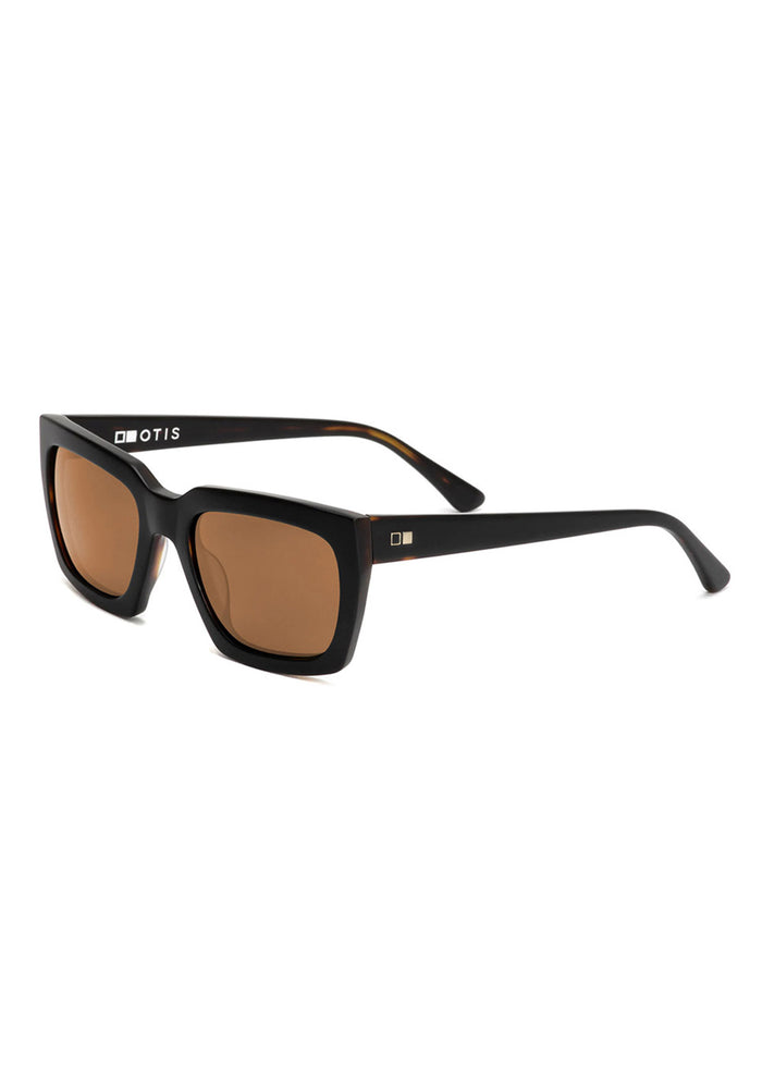 Sleek black OTIS sunglasses with brown lenses and square frames, showcasing a modern design and subtle logo on the temple.