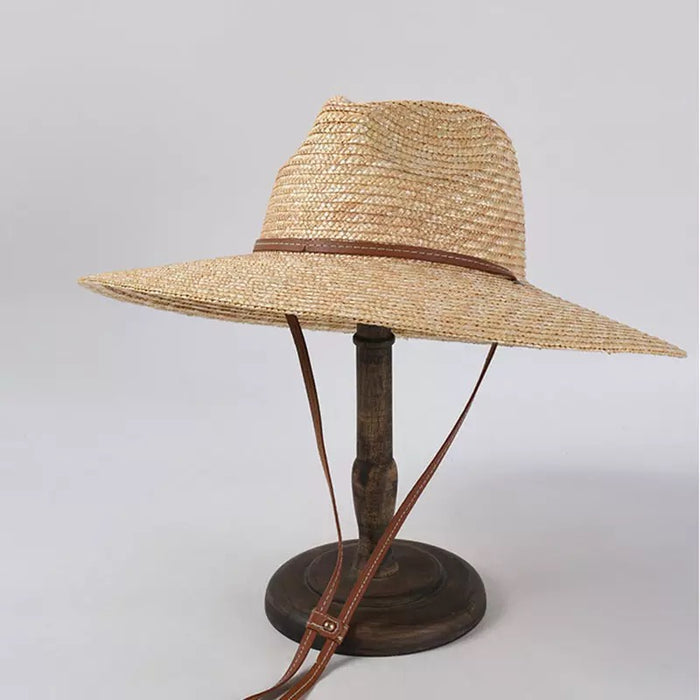 Panama wheat hat from Travellers Hat Boutique with wide brim and adjustable brown chin strap