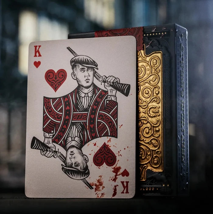 Playing card with a king of hearts design on a dark background